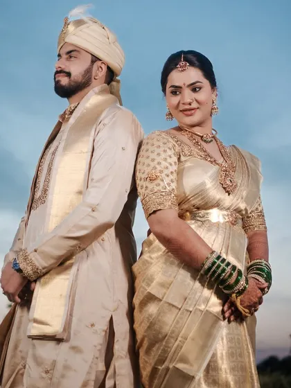 A powerful portrait of the couple. Nishitha's makeup is designed to be strong and elegant, matching the grandeur of the occasion.