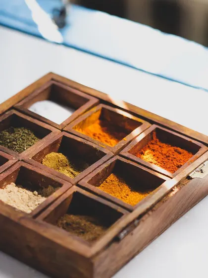 Understanding spices is fundamental. Our students learn to identify, blend, and use a variety of spices, starting with the classic Indian masala dabba.