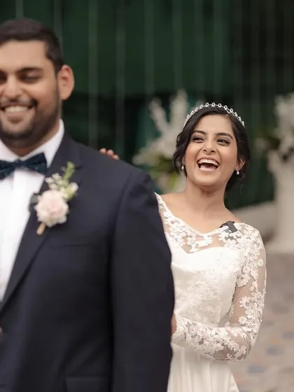 The bride's joyful laugh as she surprises her groom for the first look. A priceless, candid moment.