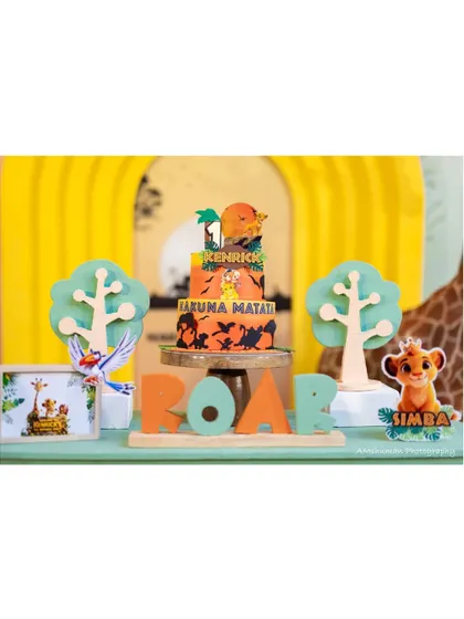 A 'ROAR' sign and a detailed Lion King cake take center stage at this jungle-themed birthday. We use custom lettering and props to make every detail count.