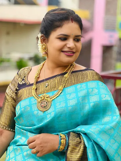 A smiling portrait, her happiness shining through, making her look even more beautiful.
