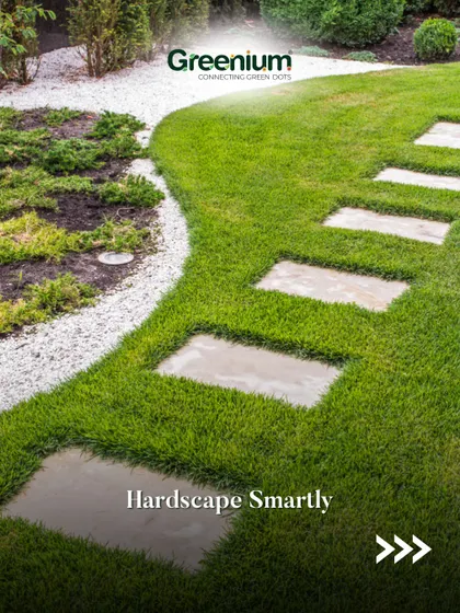 Hardscape smartly to reduce maintenance. This image shows a beautiful lawn with stone pavers and a gravel border, which reduces the amount of grass to mow and water.