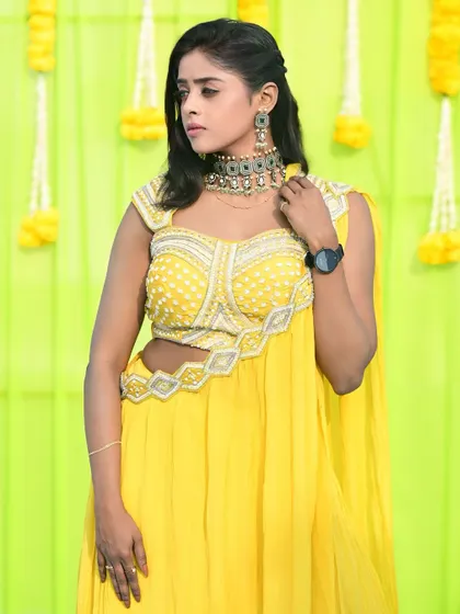 A modern choker with intricate details, rented for a festive occasion. This piece is perfect for pairing with a bright yellow lehenga for a haldi or sangeet ceremony.