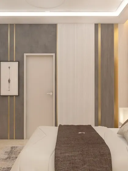 A bedroom design featuring a sophisticated color palette of grey and brown with gold metal accents. The wall behind the desk is designed with simple paneling, creating a clean backdrop for a functional workspace.