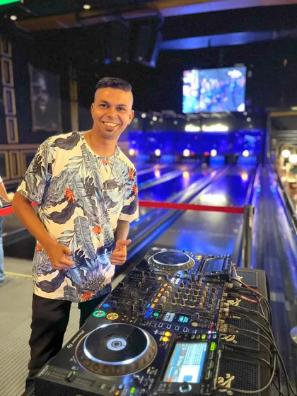Posing with a thumbs-up next to my DJ setup at a private party. I'm always happy when I'm about to start a set.