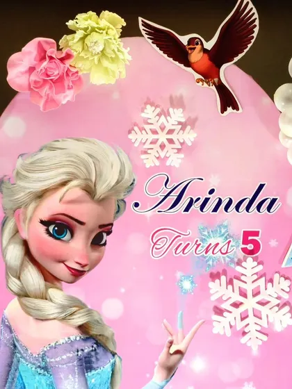 A close-up of the Elsa backdrop from a Frozen themed party.