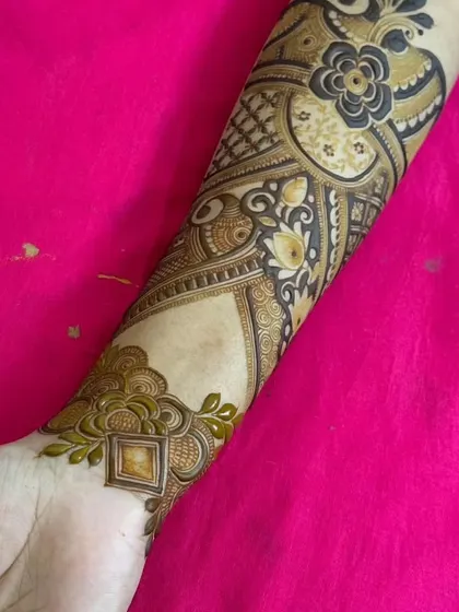 A complete forearm design that combines the bracelet from the previous image with more patterns extending up the arm.