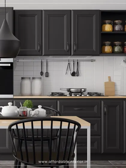 This kitchen and dining space features classic black shaker-style cabinets, a white subway tile backsplash, and a simple dining set for a timeless farmhouse look.