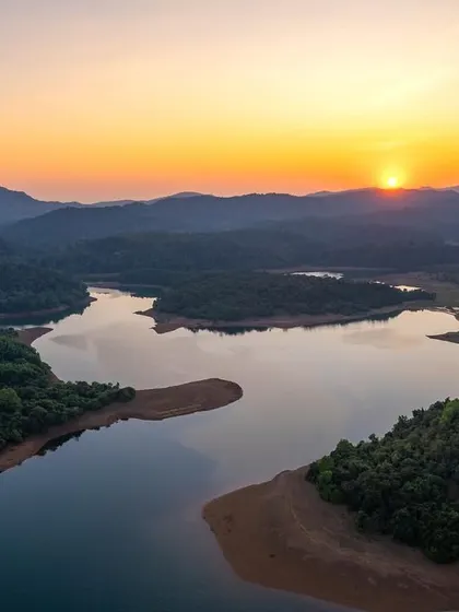 A beautiful sunset over the backwaters in the Shimoga district. The Western Ghats are renowned for these stunning natural landscapes.