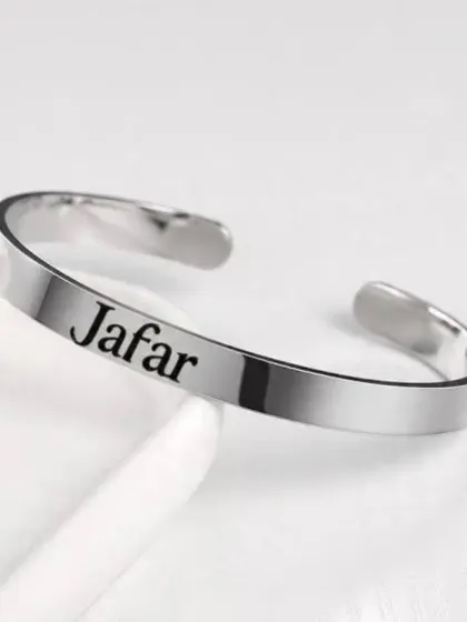 Another example of the personalized metal kada, this one engraved with the name 'Jafar' in a clean, bold font.