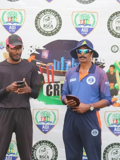 Officials preparing for the post-match presentation ceremony in front of the branded event backdrop.