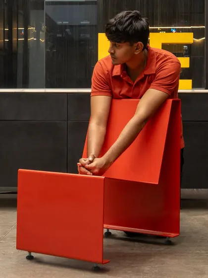 The chair's design is both a functional object and a sculptural statement. Its simple, folded metal form is a testament to our belief that good design is about finding the most honest and elegant solution to a problem.