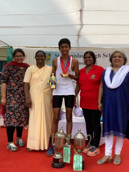 Surrounded by his teachers and mentors, Jordan is celebrated as the school's best all-round sportsman.