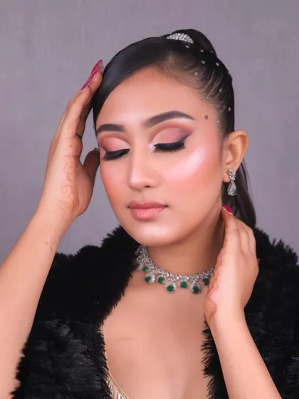 An eyes-closed shot to highlight the beautiful blending of the eyeshadow and the overall soft glam effect achieved by our student.