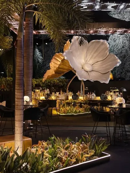This glamorous engagement party was all about creating a high-energy, unforgettable night. I used dramatic lighting, oversized metallic floral sculptures, and a sleek black and gold palette to design a modern, club-like atmosphere.