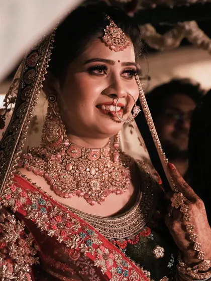 A candid close-up of the bride's happy expression, capturing the genuine joy of her wedding day.