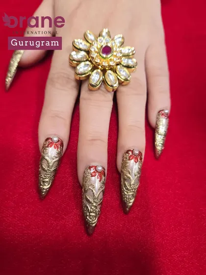 This shot highlights the rich gold chrome and delicate red details. I teach students to master these fine details for a truly professional finish.