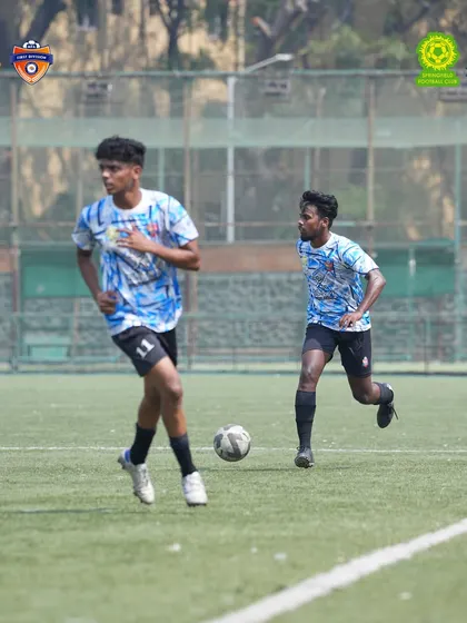Teamwork in motion. Two players work in tandem during our MFA 1st Division match. Our strategy is built on communication, movement, and supporting each other across the field.