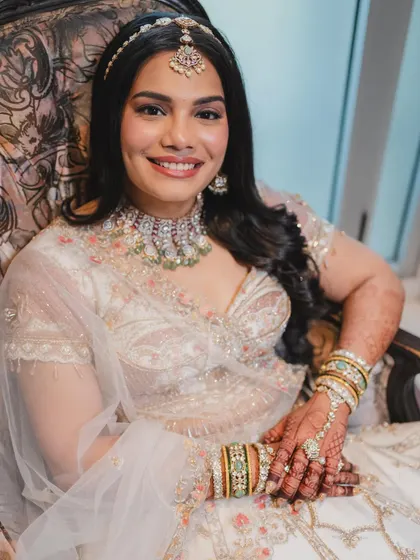 A close-up of the happy bride. The makeup enhances her natural beauty, and her smile is the perfect finishing touch.