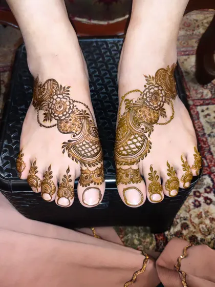 A beautiful and intricate foot design, perfect for a bride or wedding guest.