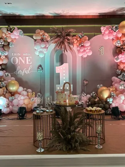 A 'Little Miss ONEderful' first birthday with a chic boho theme. The muted pink and brown tones, pampas grass, and butterfly details create a soft and stylish look.