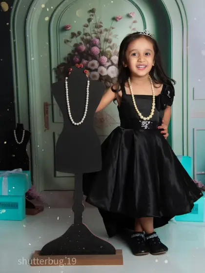 A little fashionista posing proudly in our "Tiffany & Co." inspired theme, complete with iconic blue bags and pearls.