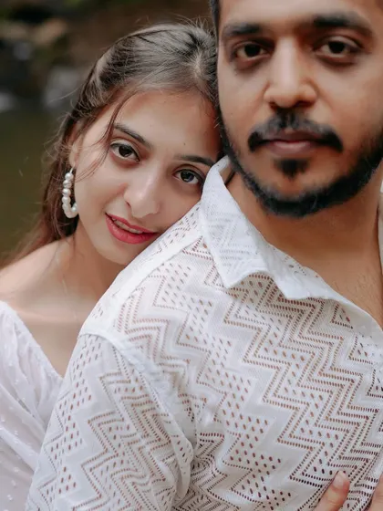 A stunning close-up portrait where she rests her head on his shoulder. This image is all about trust, comfort, and the deep affection between the couple.