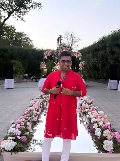 Ready at the floral aisle for the wedding ceremony. The decor is set, the mood is serene, and I am prepared to guide the couple through their vows with meaningful words.