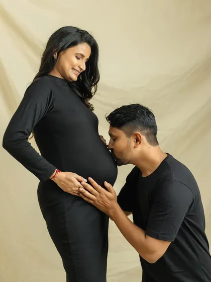 A tender kiss for the baby. This classic pose is always so full of love and anticipation, a perfect memory for the parents-to-be.