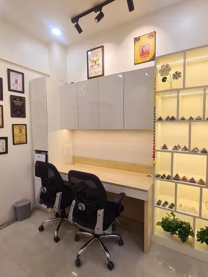 A look inside my new office, designed with Vastu principles for focus and positive energy. The workstation area is clean and well-lit, with a dedicated shelf for pyramids and energy tools to create a harmonious environment for consultations.