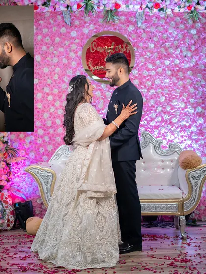 A romantic portrait of the couple during their engagement party, set against a vibrant pink floral backdrop.