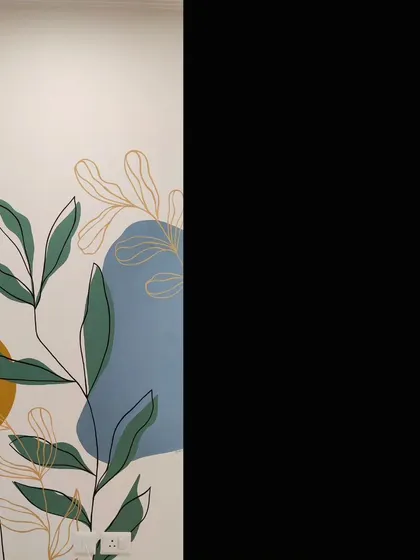 Another detail of the abstract botanical mural, showing the interplay between the solid shapes and the fine black and gold lines.
