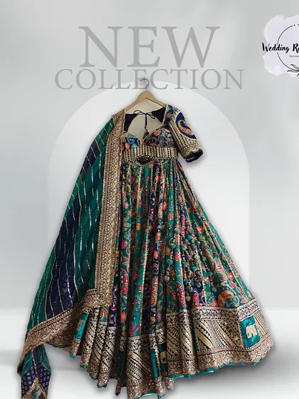 A new arrival from our collection, this multi-color printed lehenga with a deep teal base is a festive dream.