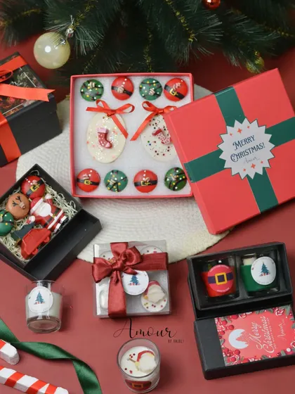 An assortment of my Christmas candle collections, showcasing the variety of festive and affordable gifting options I offer, from the 'Holly Jolly Box' to 'Merry Melts'.