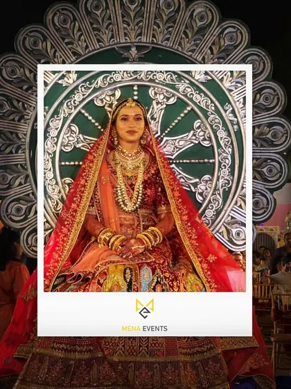 A close-up of the bride on the ornate "Singhasan" entry prop. It’s designed to look royal and grand, making the bride the absolute center of attention.
