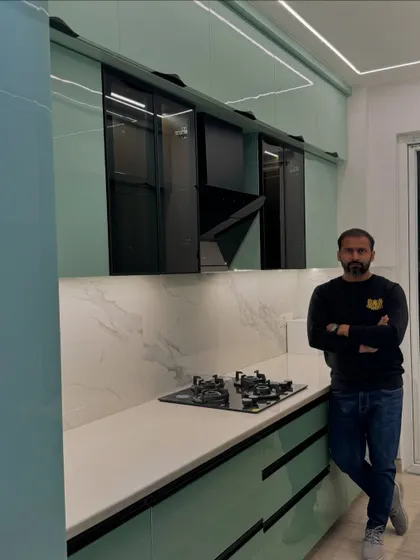Here I am in the newly finished mint green kitchen. My goal is always to deliver a space that not only looks great but is also a joy to work in.