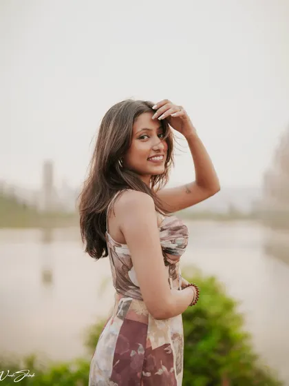 Using the soft, hazy light over the water as a backdrop, this portrait has a dreamy quality. It's a perfect example of a lifestyle shot for a modeling portfolio.