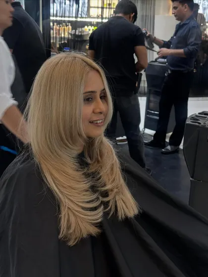 Another angle of the sleek, straight blonde style. A flat iron and heat protectant are key to achieving this super polished finish.