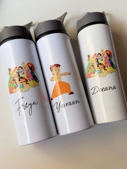 A set of personalized sipper bottles for kids, featuring their favorite characters like Disney princesses and Chhota Bheem.
