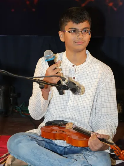 A confident Amogh addresses the audience before his performance, a skill we encourage in all our students.