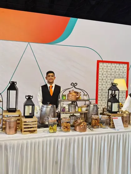 Our elaborate tea and coffee station set up for the Air India "Gourmair" launch. We offer a wide selection of beverages and snacks, presented with rustic charm using copper kettles and wooden crates.