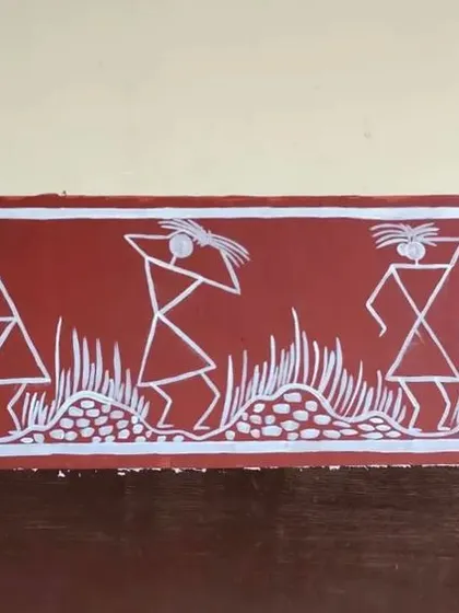 A panel showing figures carrying items on their heads and interacting with nature. The repetition of human and plant forms creates a rhythmic pattern typical of Warli art borders.