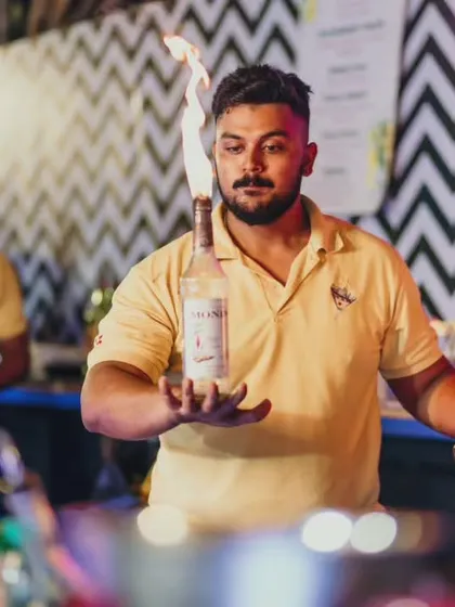 Juggling fire and spirits with intense focus. Our flair bartenders are not just performers, they are skilled professionals who ensure safety and quality.