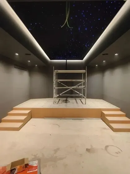 Another view of the room during construction, with scaffolding in place for work on the ceiling and high walls.