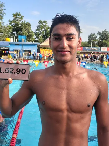 Dhakshan S proudly displaying his record time of 1:52.90 in the 200m Freestyle.