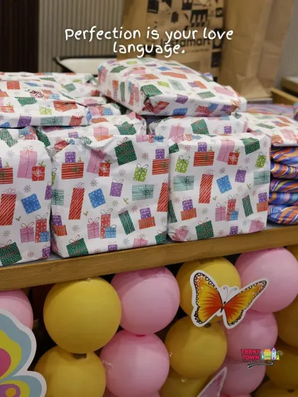 Perfectly wrapped return gifts that match the butterfly party theme, showing how I coordinate every last detail.