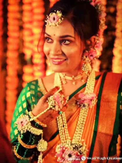 A close-up of this happy bride. You can see the detail in her floral necklace and hathphool, designed to be both intricate and comfortable.