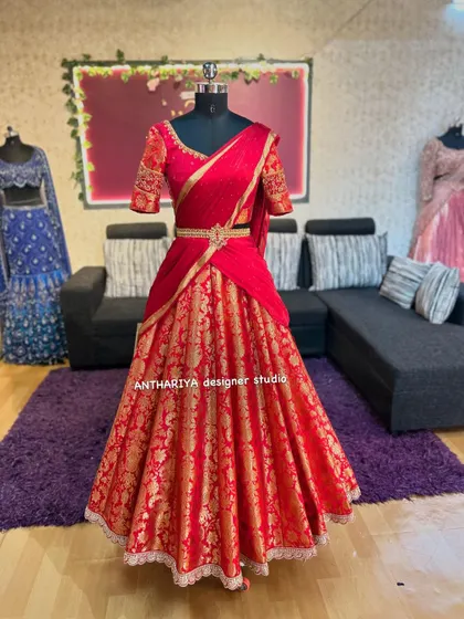 The front view of the vibrant all-red lehenga, a truly celebratory outfit.