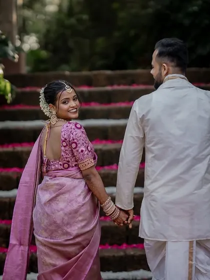 A playful and romantic moment on the steps of The Peacock Grove. We encourage our couples to be themselves, which allows us to capture their unique personalities and connection.