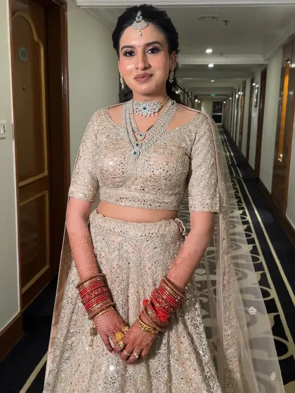 Damini looks effortlessly beautiful. This shot captures the essence of her modern bridal style, where the focus is on glowing skin and understated glamour.
